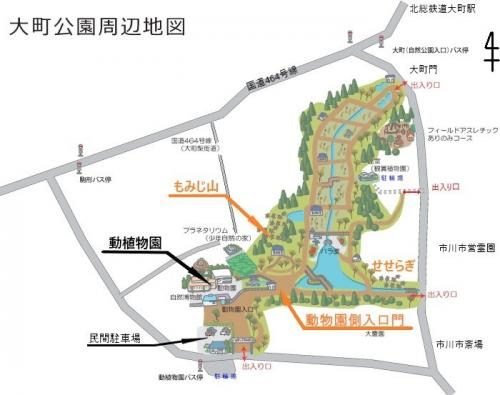 大町公園の周辺地図。北総鉄道大町駅、大町門、もみじ山、せせらぎ、動植物園、動物園側入口門、民間駐車場の位置が示されている