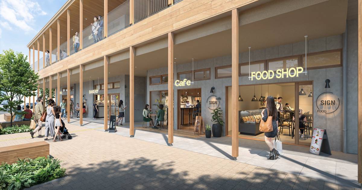 木の柱が並ぶ2階建ての木造商業施設の1階に、カフェや食品店が入る完成予想図